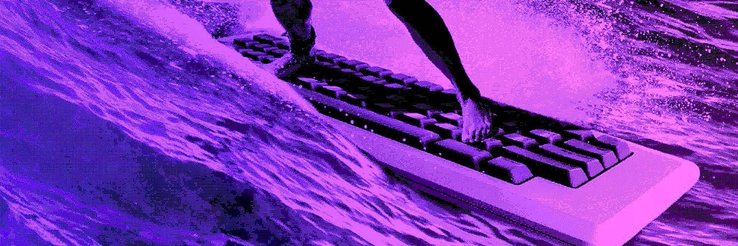 A hand surfing a keyboard across a wave